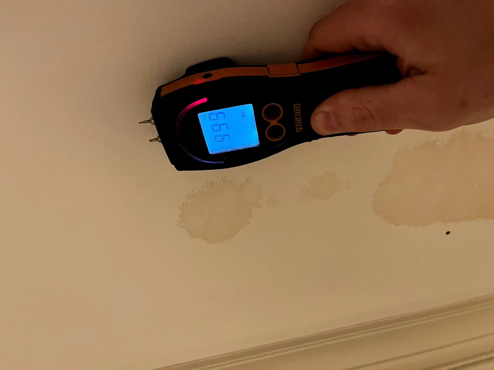 Moisture meter detecting ceiling water damage — Lowell, MI