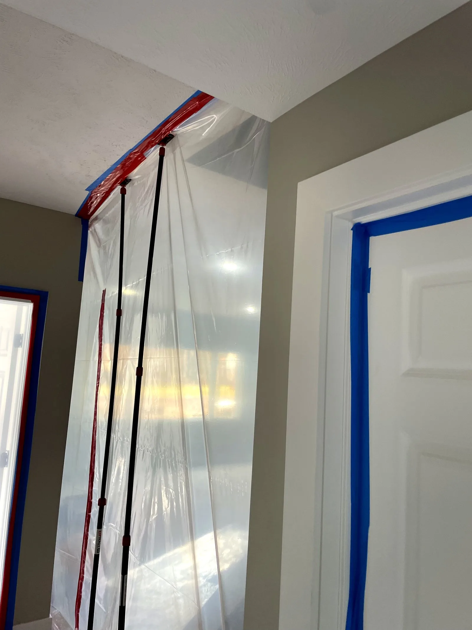 Professional containment barrier protecting home during restoration — East Grand Rapids, MI