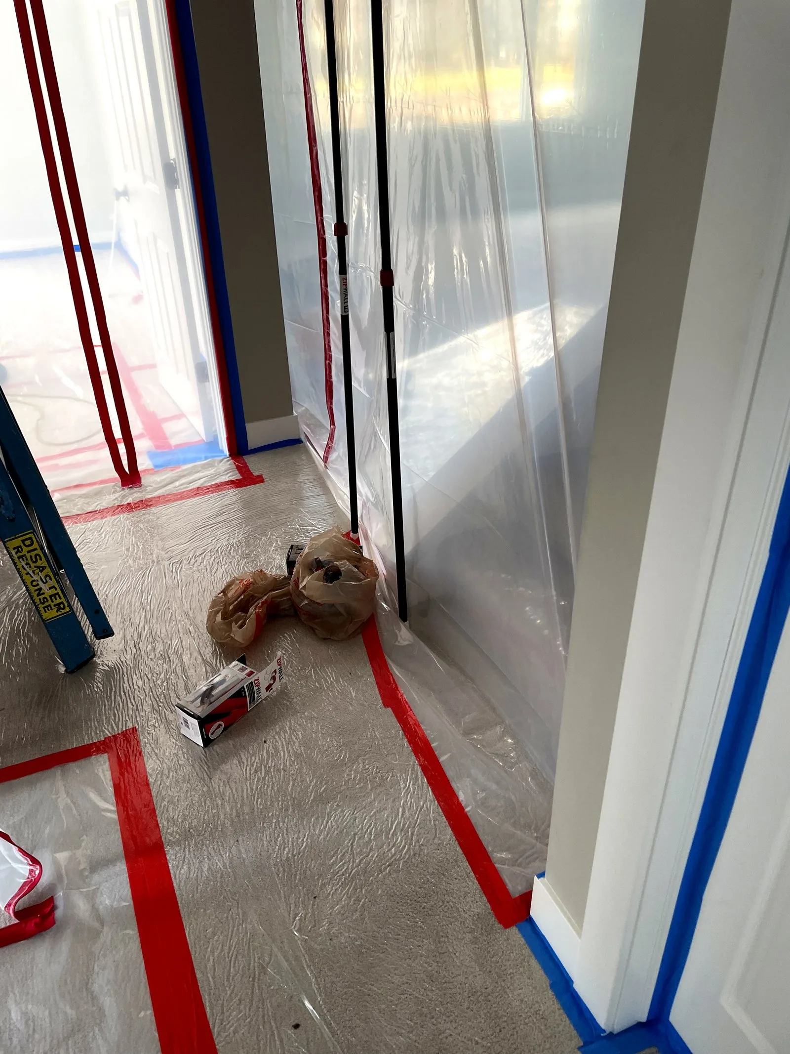 Hallway containment during water damage restoration — East Grand Rapids, MI